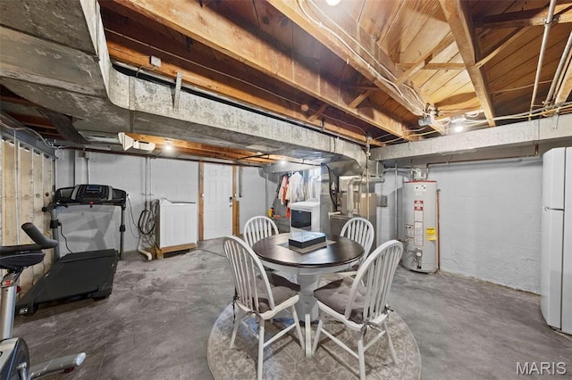 8452 S Laclede Station Rd, Saint Louis, MO 63123 - unfinished basement with gas water heater, washer / clothes dryer, and freestanding refrigerator