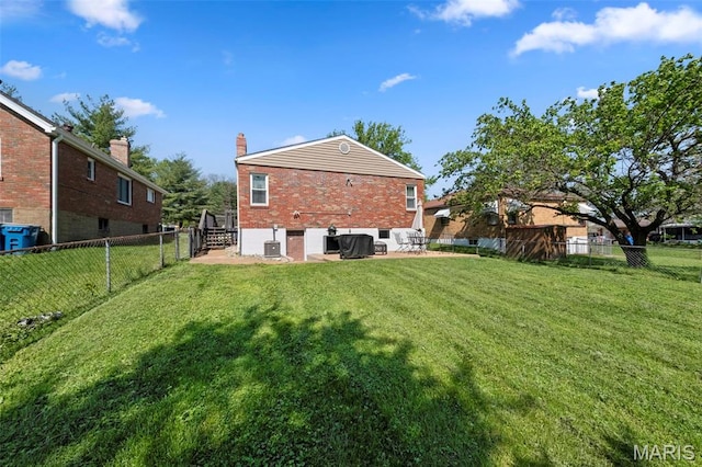 8452 S Laclede Station Rd, Saint Louis, MO 63123 - rear view of house with brick siding, a chimney, and central air condition unit