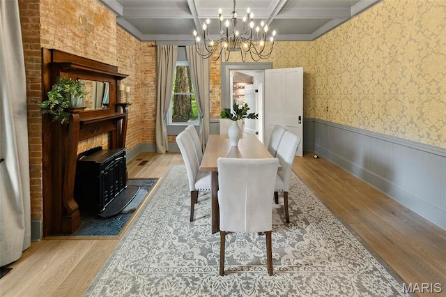 2367 Central Ave, Alton, IL 62002 - dining space with wood finished floors, a chandelier, coffered ceiling, a wainscoted wall, and beamed ceiling