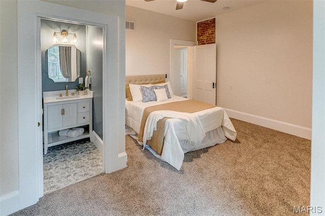 2367 Central Ave, Alton, IL 62002 - bedroom with a sink, carpet flooring, ensuite bath, and baseboards