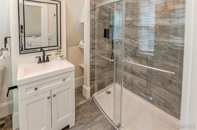 2367 Central Ave, Alton, IL 62002 - bathroom featuring a shower stall, toilet, vanity, and marble finish flooring