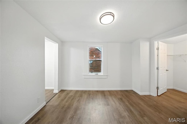 202 N Thomas St, De Soto, MO 63020 - empty room with wood finished floors and baseboards