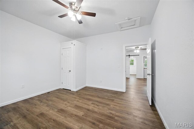 202 N Thomas St, De Soto, MO 63020 - unfurnished bedroom with attic access, dark wood finished floors, baseboards, and ceiling fan