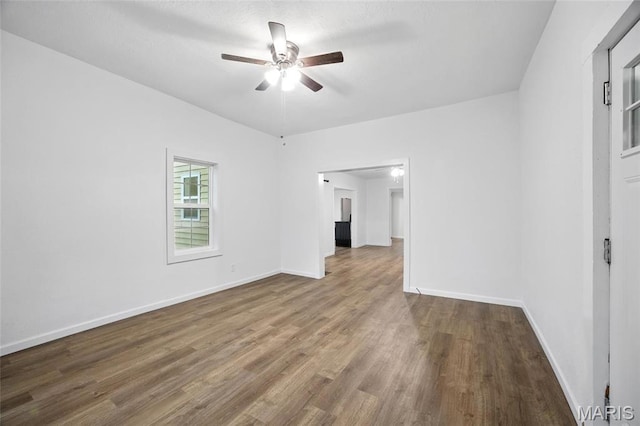 202 N Thomas St, De Soto, MO 63020 - unfurnished room featuring a ceiling fan, wood finished floors, and baseboards