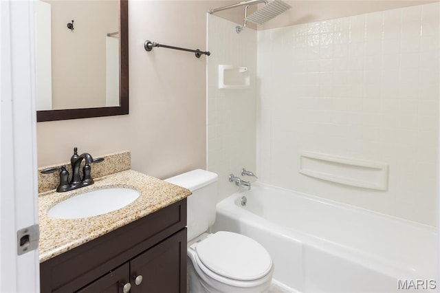 bathroom with toilet, vanity, and tub / shower combination
