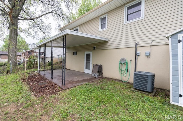back of house with a patio and central AC unit