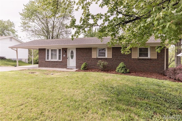 single story home featuring brick siding, driveway, a front yard, and an attached carport