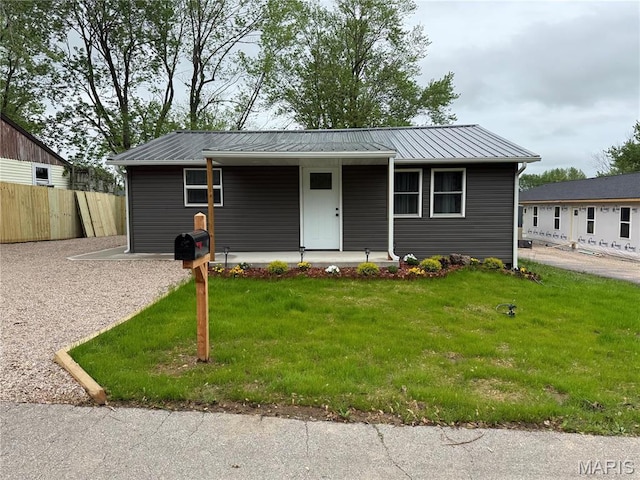 229 Siebenman St, Bourbon, MO 65441 - view of front facade with a porch and metal roof