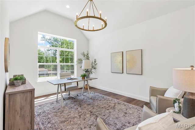 office with a chandelier, wood finished floors, baseboards, and high vaulted ceiling