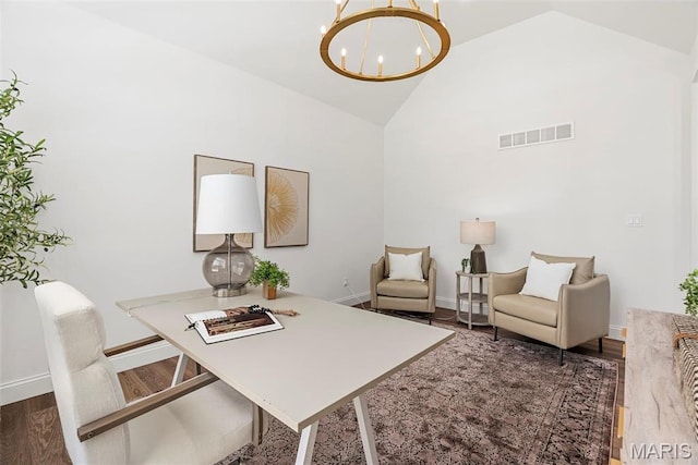 office area featuring a chandelier, high vaulted ceiling, baseboards, and wood finished floors