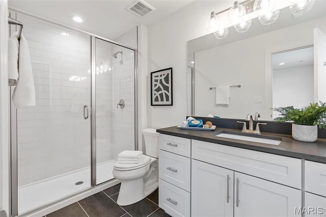 full bath with tile patterned flooring, toilet, a shower stall, and vanity