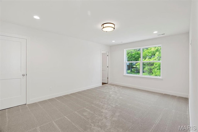 carpeted spare room with baseboards and recessed lighting