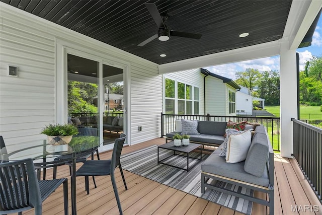 deck with an outdoor hangout area, ceiling fan, and outdoor dining space