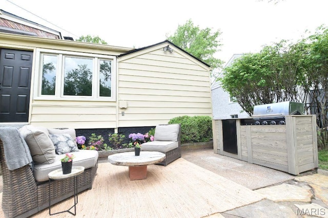 view of patio / terrace with an outdoor kitchen and grilling area