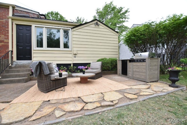 view of patio / terrace featuring area for grilling, an outdoor kitchen, and fence
