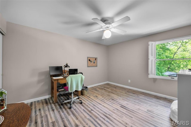 home office with wood finished floors, baseboards, and ceiling fan