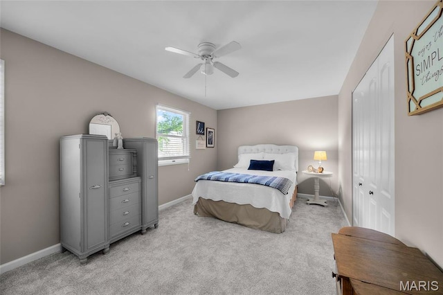 bedroom with baseboards, light colored carpet, and ceiling fan