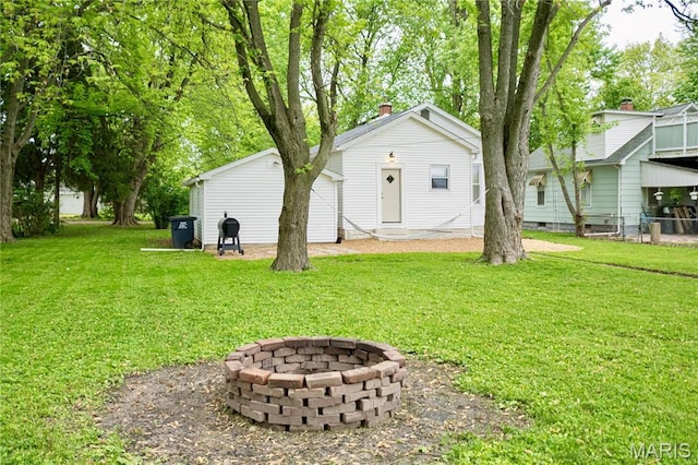 504 Henrietta St, Gillespie, IL 62033 - view of green lawn featuring a fire pit