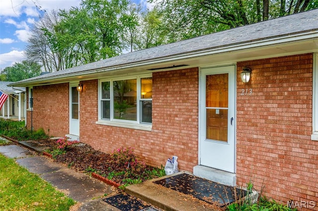 213 Joseph Dr, Fairview Heights, IL 62208 - doorway to property with brick siding and roof with shingles