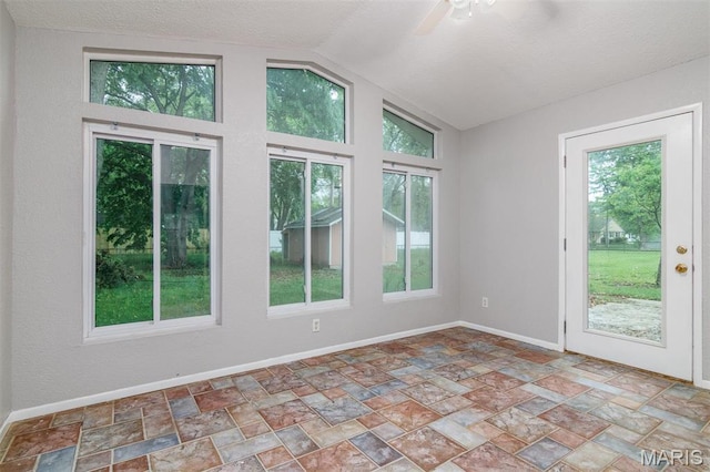 213 Joseph Dr, Fairview Heights, IL 62208 - unfurnished room with plenty of natural light, vaulted ceiling, a ceiling fan, stone finish floors, and a textured ceiling