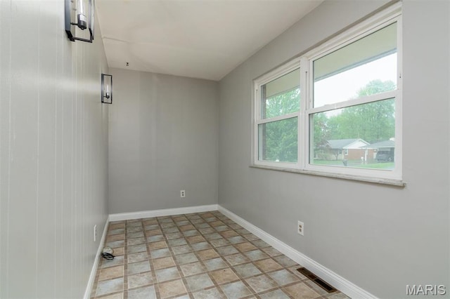 213 Joseph Dr, Fairview Heights, IL 62208 - spare room with baseboards and stone finish flooring