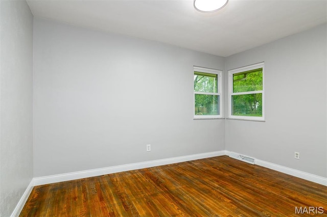 213 Joseph Dr, Fairview Heights, IL 62208 - unfurnished room featuring baseboards and dark wood-type flooring