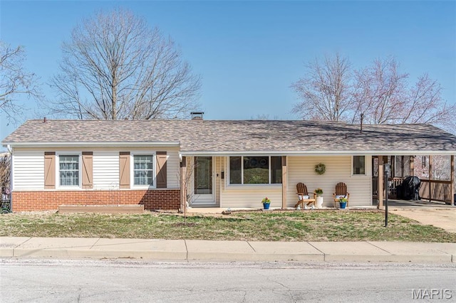 729 W State St, Union, MO 63084 - ranch-style home with brick siding, a carport, concrete driveway, a chimney, and a front yard