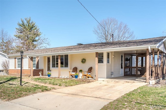 729 W State St, Union, MO 63084 - ranch-style home featuring an attached carport, driveway, covered porch, a front yard, and brick siding
