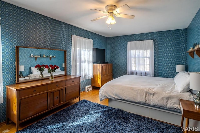 729 W State St, Union, MO 63084 - bedroom featuring light wood-type flooring, a ceiling fan, and wallpapered walls