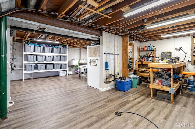 729 W State St, Union, MO 63084 - unfinished basement with a workshop area, wood finished floors, and a sink