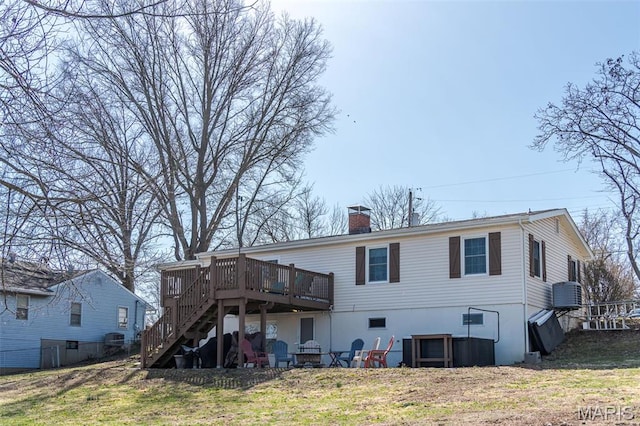 729 W State St, Union, MO 63084 - rear view of house with a wooden deck, stairs, and a chimney