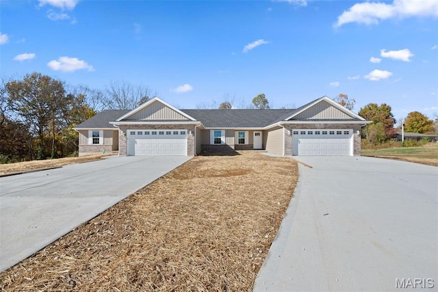 282 Railroad St, Moscow Mills, MO 63362 - view of front of home with an attached garage, concrete driveway, and brick siding