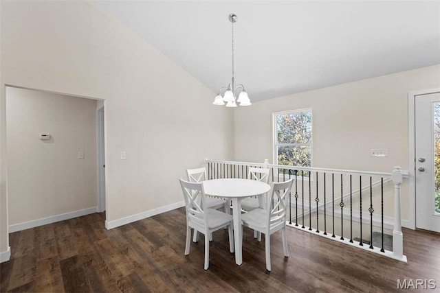 282 Railroad St, Moscow Mills, MO 63362 - dining room with wood finished floors, vaulted ceiling, baseboards, and a chandelier