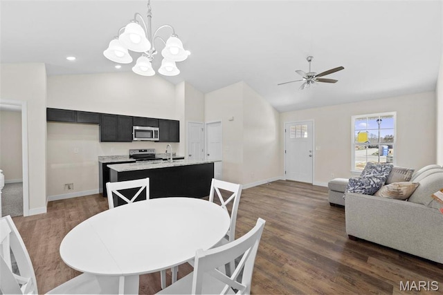 282 Railroad St, Moscow Mills, MO 63362 - dining room with lofted ceiling, baseboards, dark wood-style flooring, a chandelier, and ceiling fan