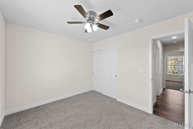 282 Railroad St, Moscow Mills, MO 63362 - unfurnished bedroom featuring carpet floors, baseboards, a closet, and ceiling fan