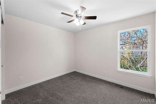 282 Railroad St, Moscow Mills, MO 63362 - spare room with baseboards, carpet, and a ceiling fan