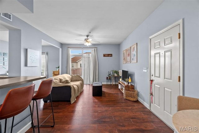 1239 Gardens Circle Dr Unit I, Saint Louis, MO 63125 - living room with a ceiling fan, dark wood-style flooring, and baseboards