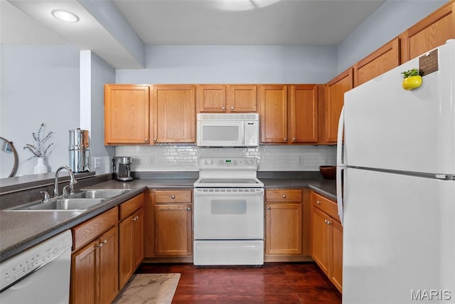 1239 Gardens Circle Dr Unit I, Saint Louis, MO 63125 - kitchen with white appliances, a sink, dark wood finished floors, and backsplash