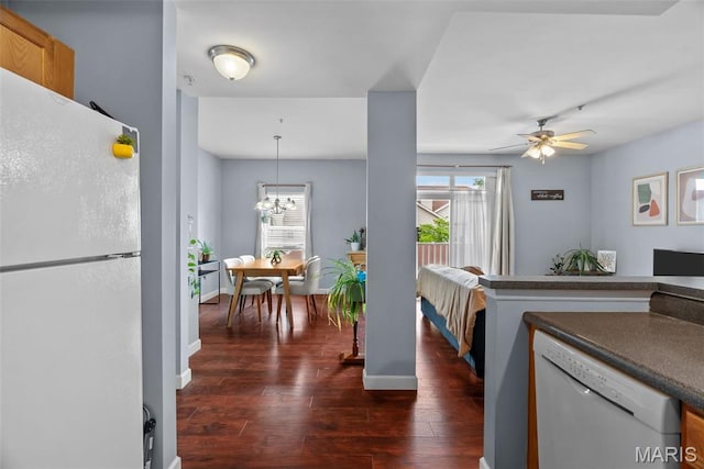 1239 Gardens Circle Dr Unit I, Saint Louis, MO 63125 - kitchen featuring white appliances, dark wood finished floors, healthy amount of natural light, and a ceiling fan