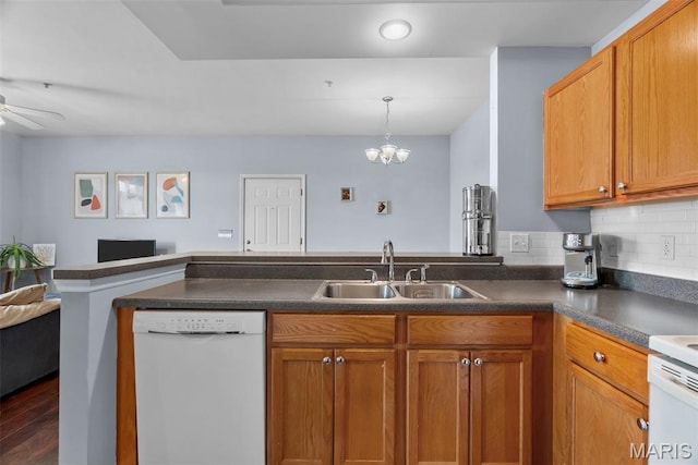 1239 Gardens Circle Dr Unit I, Saint Louis, MO 63125 - kitchen featuring dishwasher, a sink, open floor plan, dark countertops, and brown cabinets
