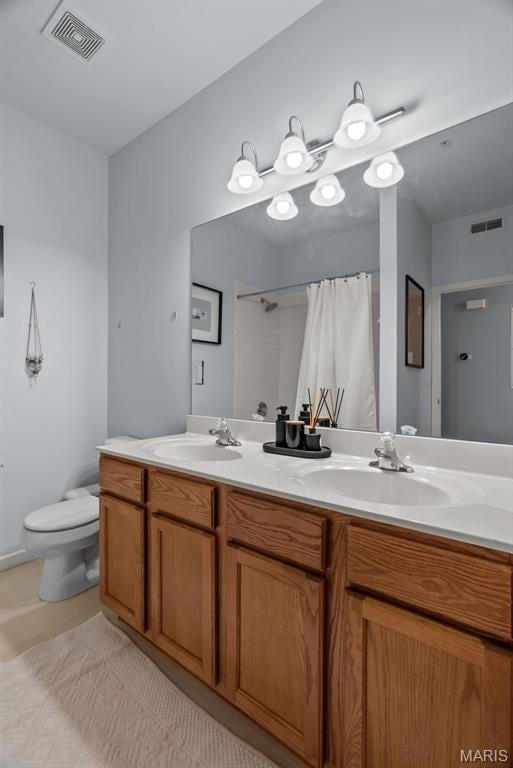 1239 Gardens Circle Dr Unit I, Saint Louis, MO 63125 - bathroom with double vanity, toilet, tile patterned flooring, and curtained shower