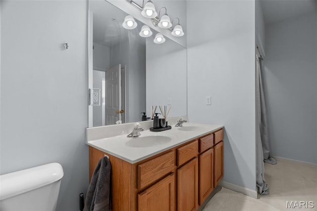 1239 Gardens Circle Dr Unit I, Saint Louis, MO 63125 - bathroom with double vanity and toilet