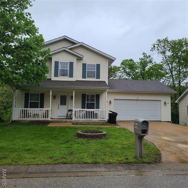 8 Nathan St, Waynesville, MO 65583 - view of front of property featuring driveway, a garage, a front yard, and covered porch