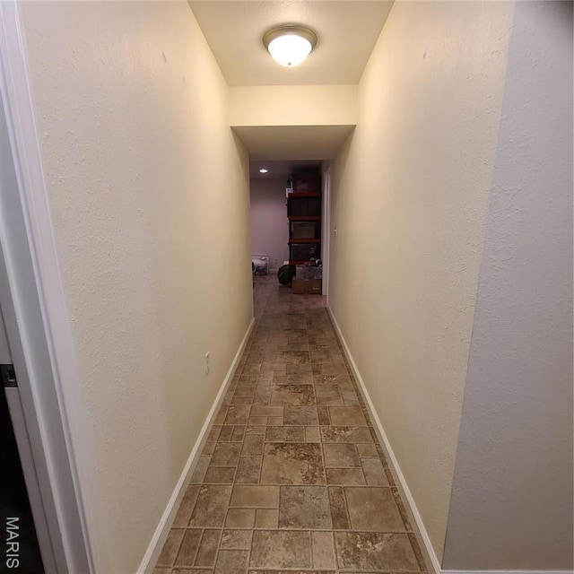 8 Nathan St, Waynesville, MO 65583 - corridor featuring stone tile floors and baseboards