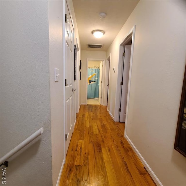 8 Nathan St, Waynesville, MO 65583 - hallway featuring wood finished floors and baseboards