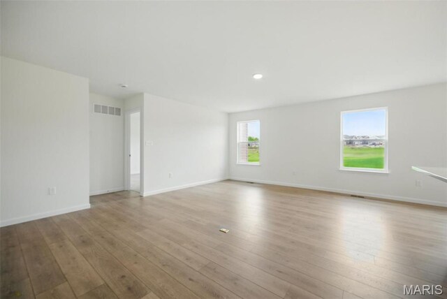 114 Harrow Dr, Ofallon, MO 63385 - unfurnished room with light wood-style floors, baseboards, and recessed lighting