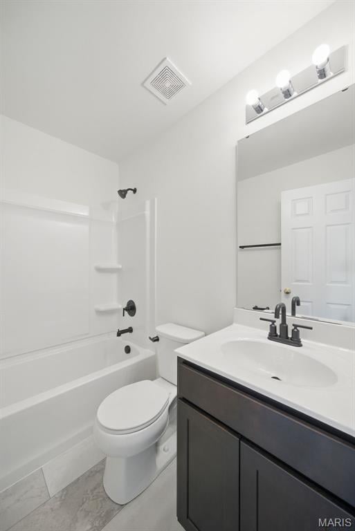 114 Harrow Dr, Ofallon, MO 63385 - full bathroom with vanity, toilet, washtub / shower combination, and marble finish floors