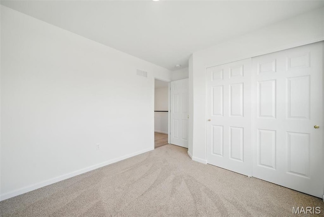 114 Harrow Dr, Ofallon, MO 63385 - unfurnished bedroom featuring carpet floors, baseboards, and a closet