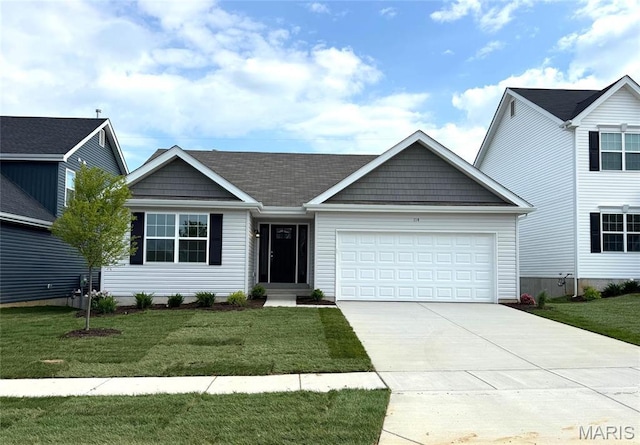 114 Harrow Dr, Ofallon, MO 63385 - view of front facade with a garage, concrete driveway, and a front yard