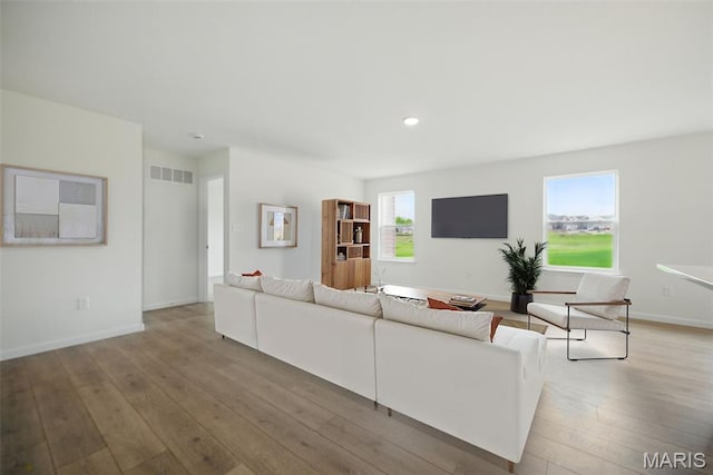114 Harrow Dr, Ofallon, MO 63385 - living room featuring wood-type flooring, baseboards, and recessed lighting